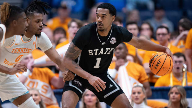 Mississippi State Bulldogs forward Tolu Smith drives against Tennessee Volunteers forward Jonas Aidoo.
